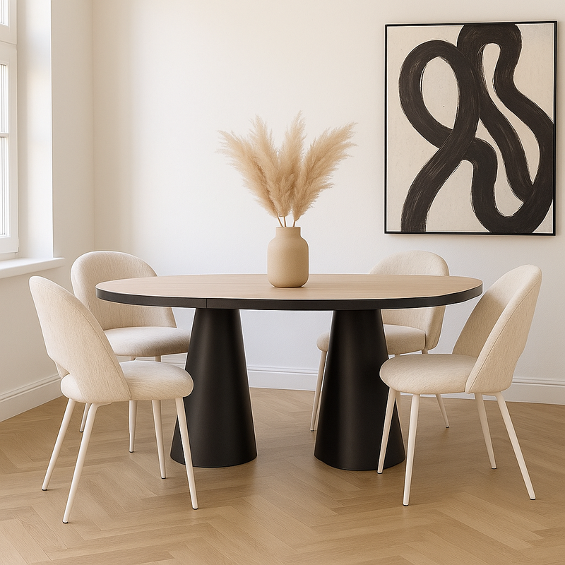 Dining room with a round table and chairs, featuring a vase with dried plants and abstract art on the wall.