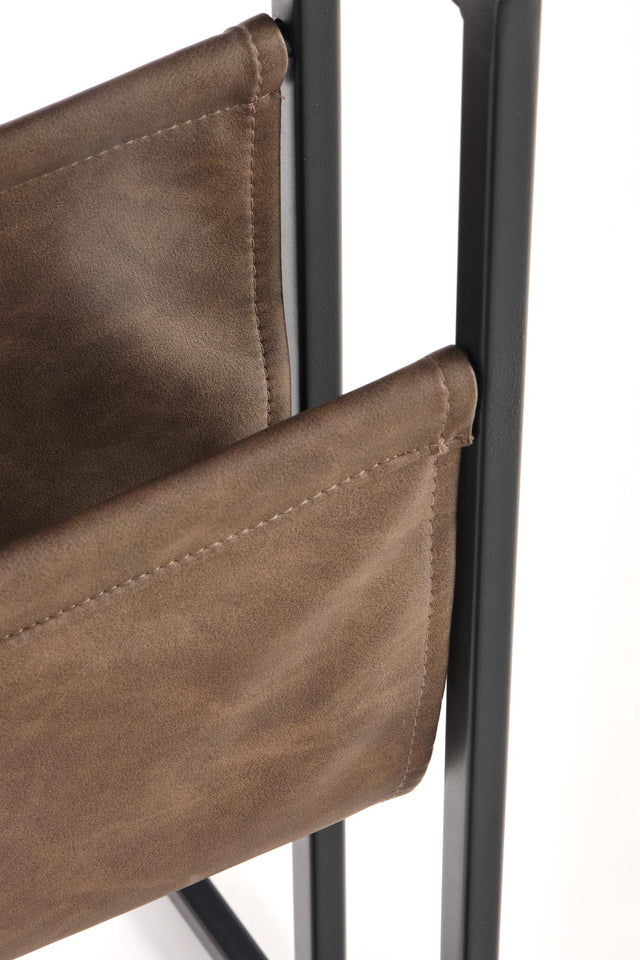 Close-up of brown leather chair with metal frame on a white background